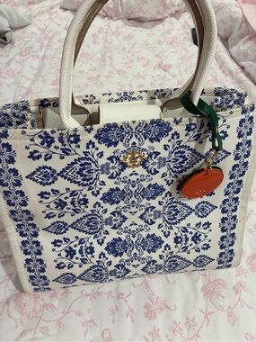 Nanette Lepore White Canvas Tote with Blue Floral Print and Orange Charm